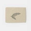 A_photograph_features_a_folded_beige_bath_towel_ma
